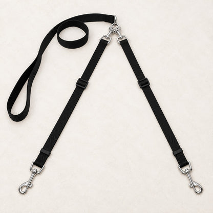 Double dog leash with one loop handle splitting into two leads and metal snap hooks