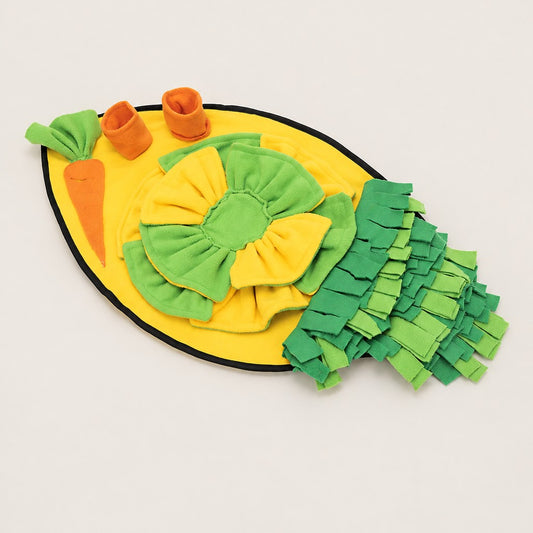 Yellow oval snuffle mat with green rosette, carrot patch, two orange cups and green fringe strips