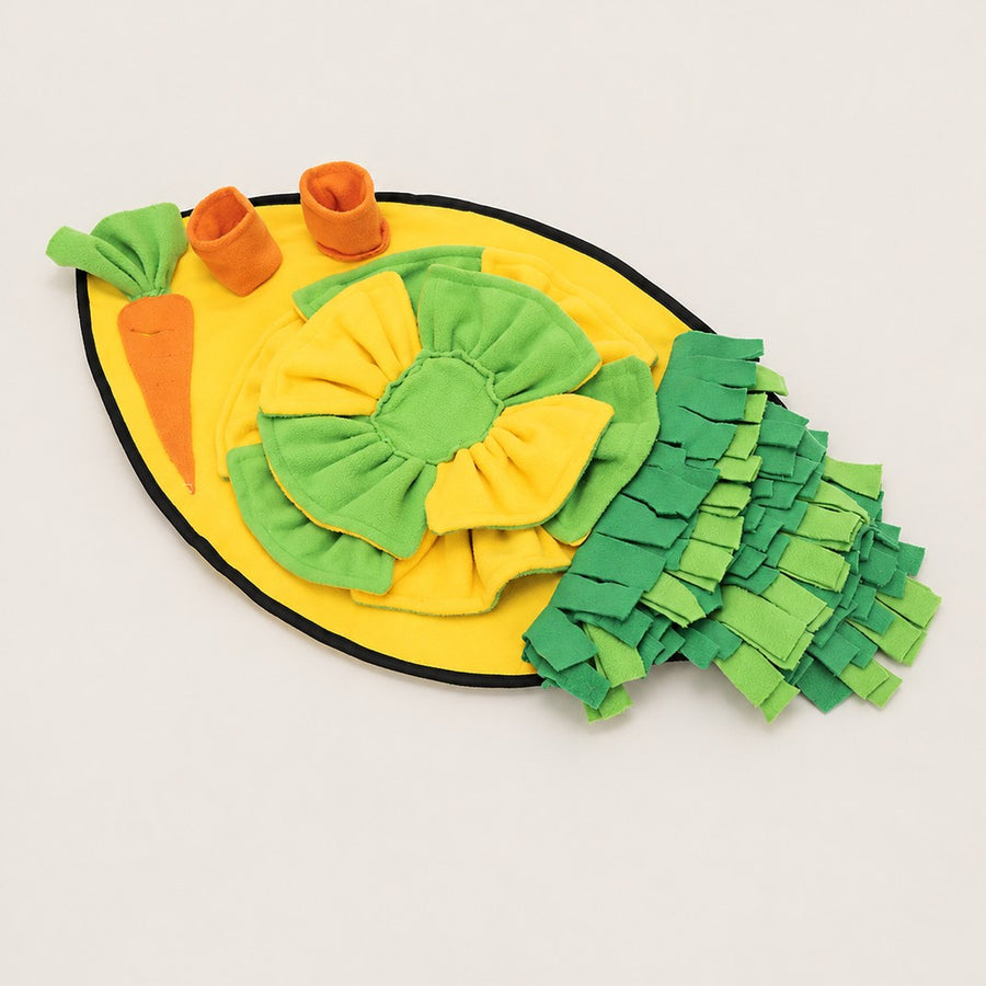 Yellow oval snuffle mat with green rosette, carrot patch, two orange cups and green fringe strips