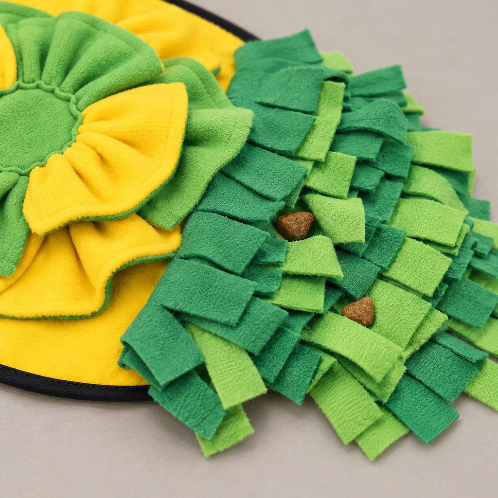 Close-up of the green fringe strips where treats can be hidden