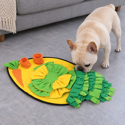 Cream French bulldog sniffing the snuffle mat, whole mat visible on the floor