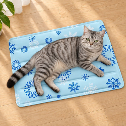 Cat lying out full length on the blue snowflake mat