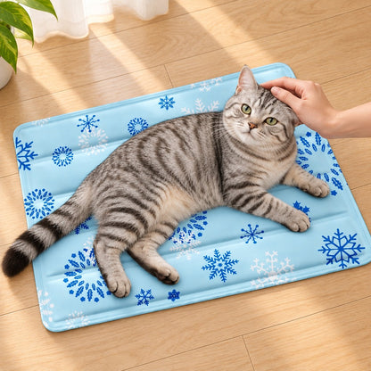 Hand stroking a tabby cat as it rests on the mat