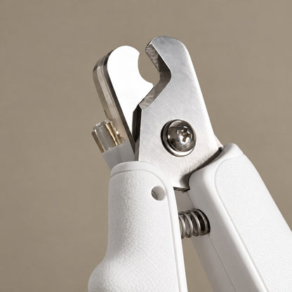 Close-up of the clipper's metal blade, pivot screw and spring