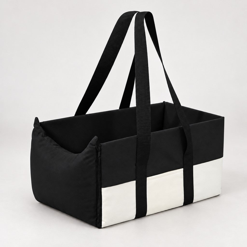 Black and cream open-topped pet car bed with two black handles on a light background