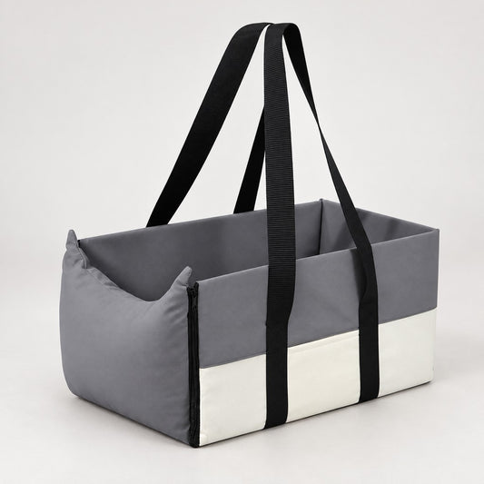 Grey and cream open-topped pet car bed with two black handles on white background