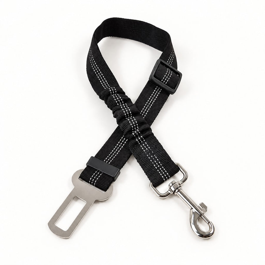 Black adjustable seat belt strap with reflective stitching, swivel clip and metal buckle tongue on white