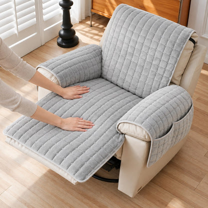 Hands smoothing the quilted throw flat over the seat of the chair