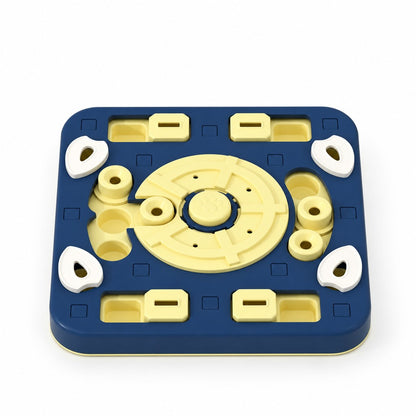 Square navy and yellow food puzzle plate with white lids and a round paw-print centre disc