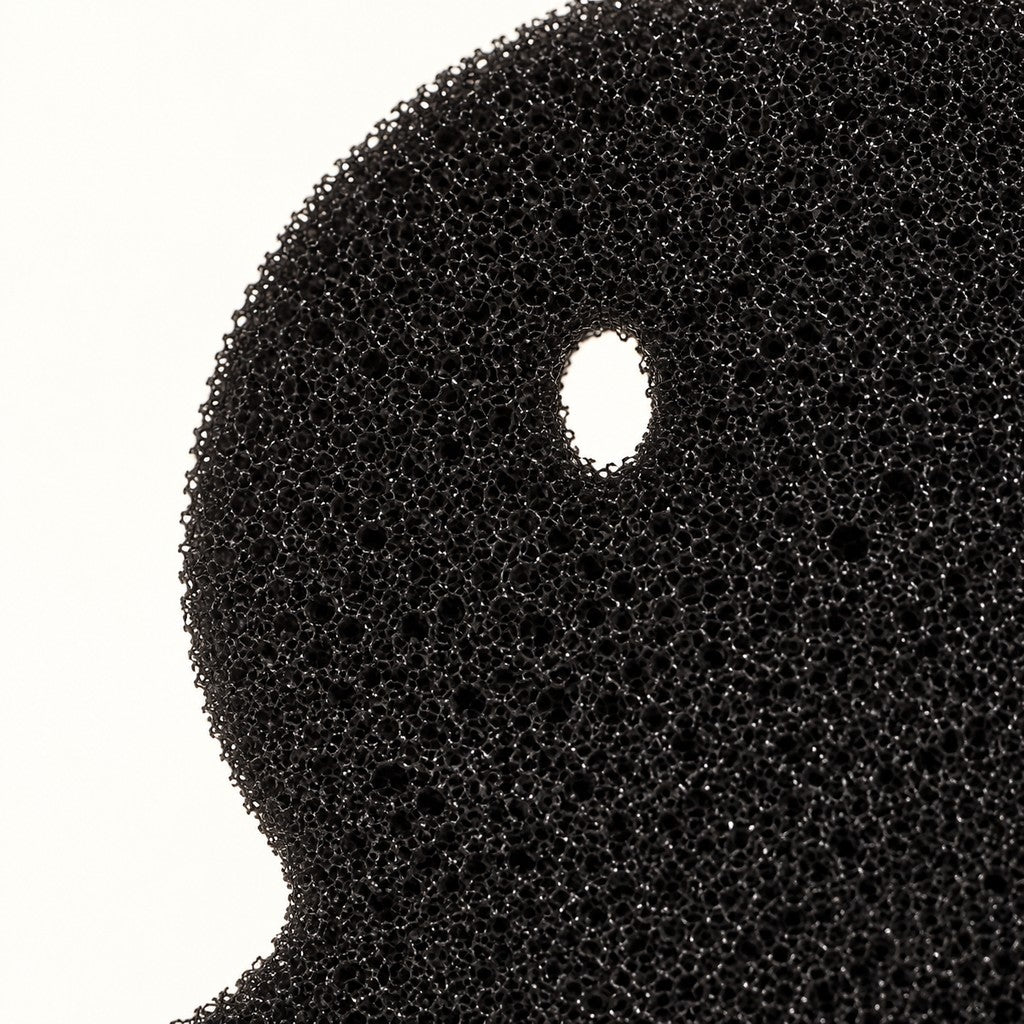 Close-up of the open-pore black foam texture
