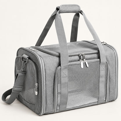Grey duffel-style pet carrier bag with mesh side windows, two top handles and shoulder strap