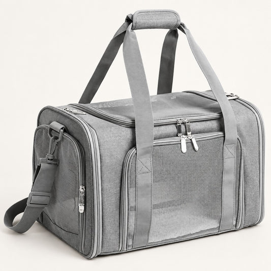 Grey duffel-style pet carrier bag with mesh side windows, two top handles and shoulder strap