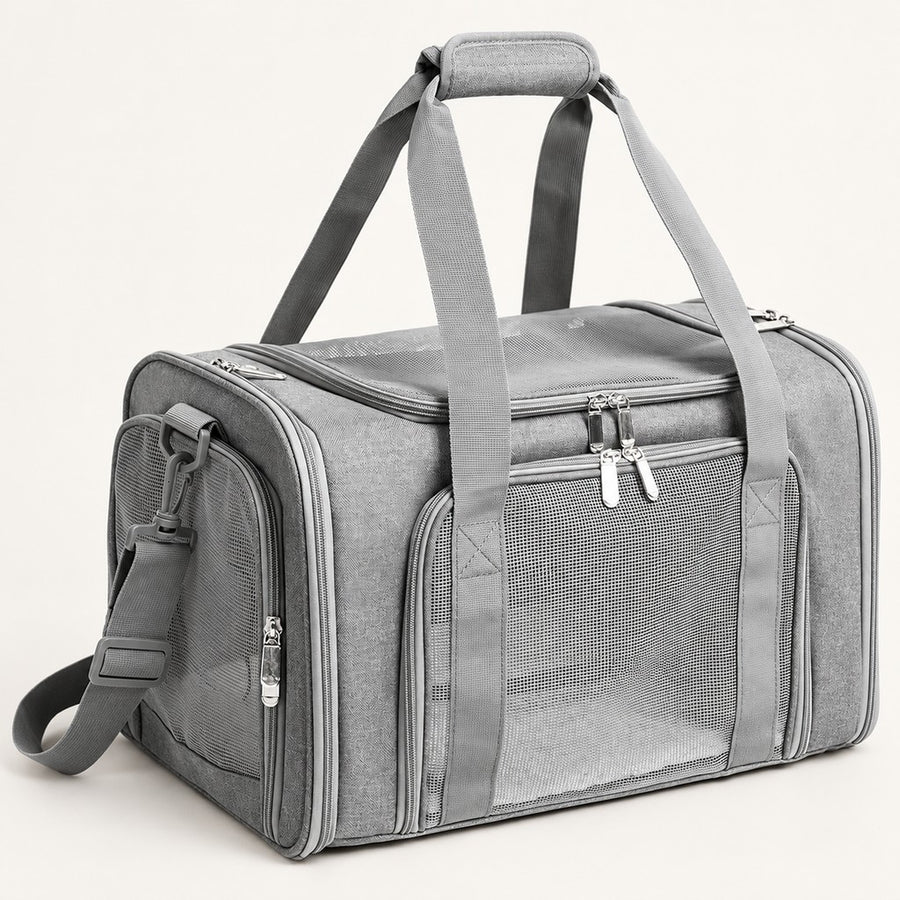 Grey duffel-style pet carrier bag with mesh side windows, two top handles and shoulder strap