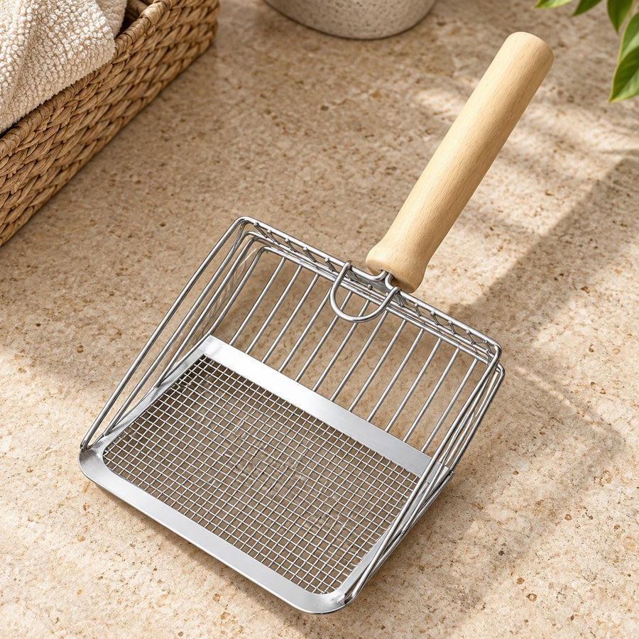 Silver metal cat litter scoop with fine mesh edge, open rods and light wooden handle