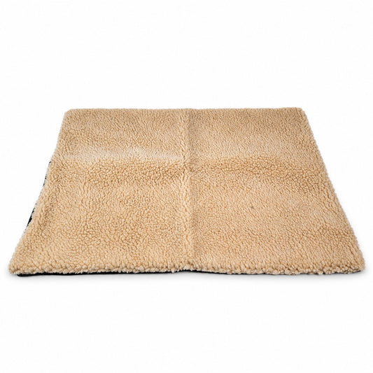 Flat sand-beige sherpa pet mat with a centre seam on a white background