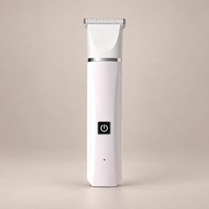 Slim white pet hair trimmer with wide comb head, silver band and black button