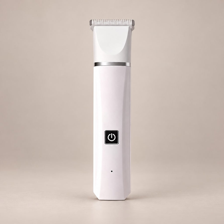 Slim white pet hair trimmer with wide comb head, silver band and black button