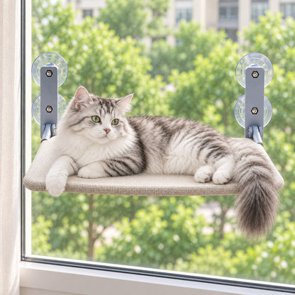 Grey and white longhaired cat lying on the window shelf, resting by the glass