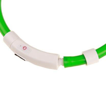 Close-up of the white control unit with power button, ribbed join and sliding ring on green tube