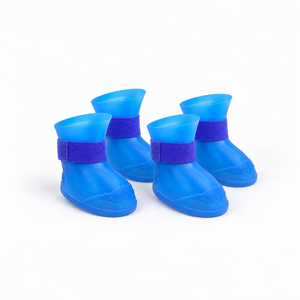 Set of four blue booties with purple straps arranged on white background